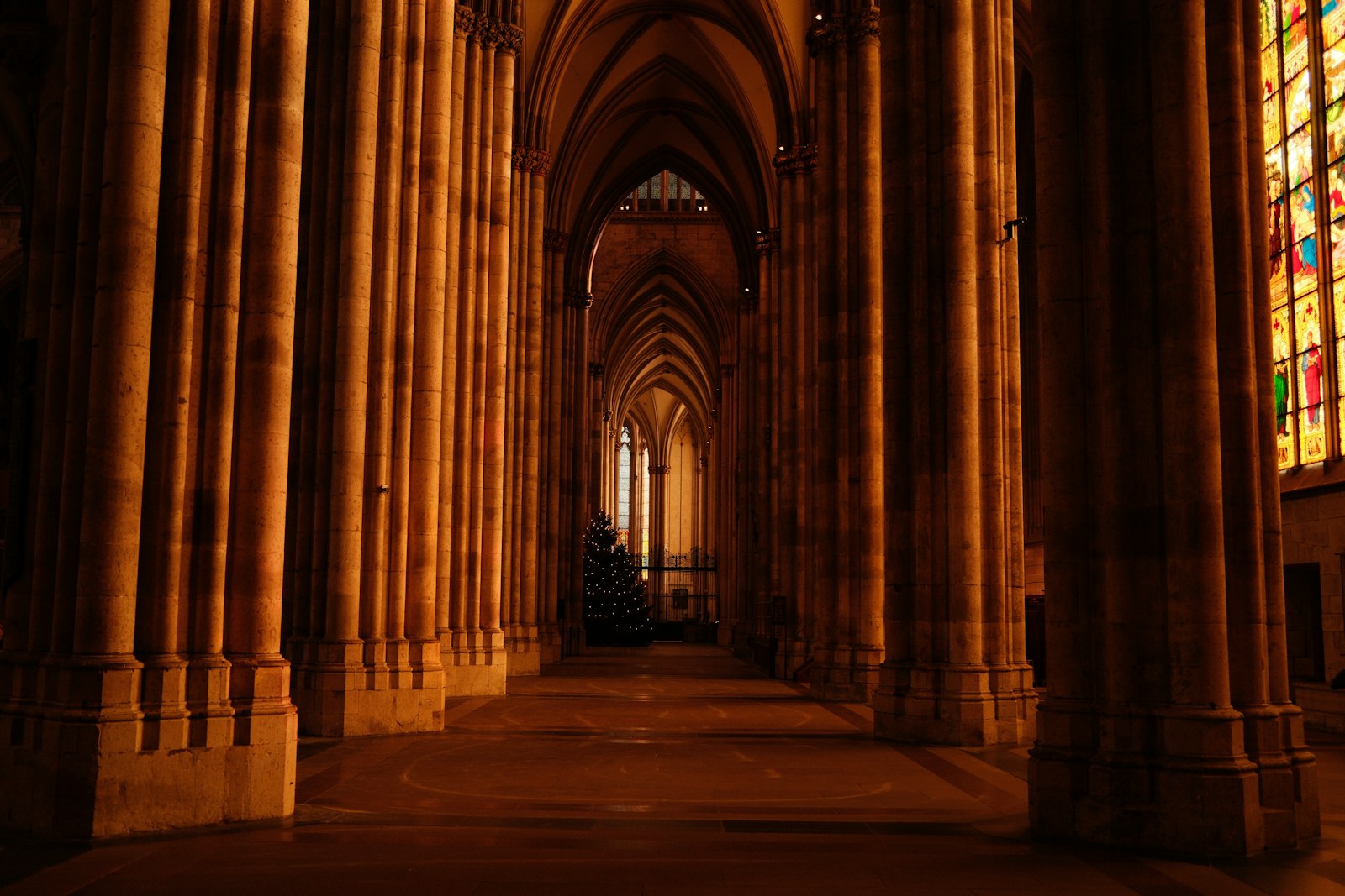 Gothic church interior with tall columns and stained glass