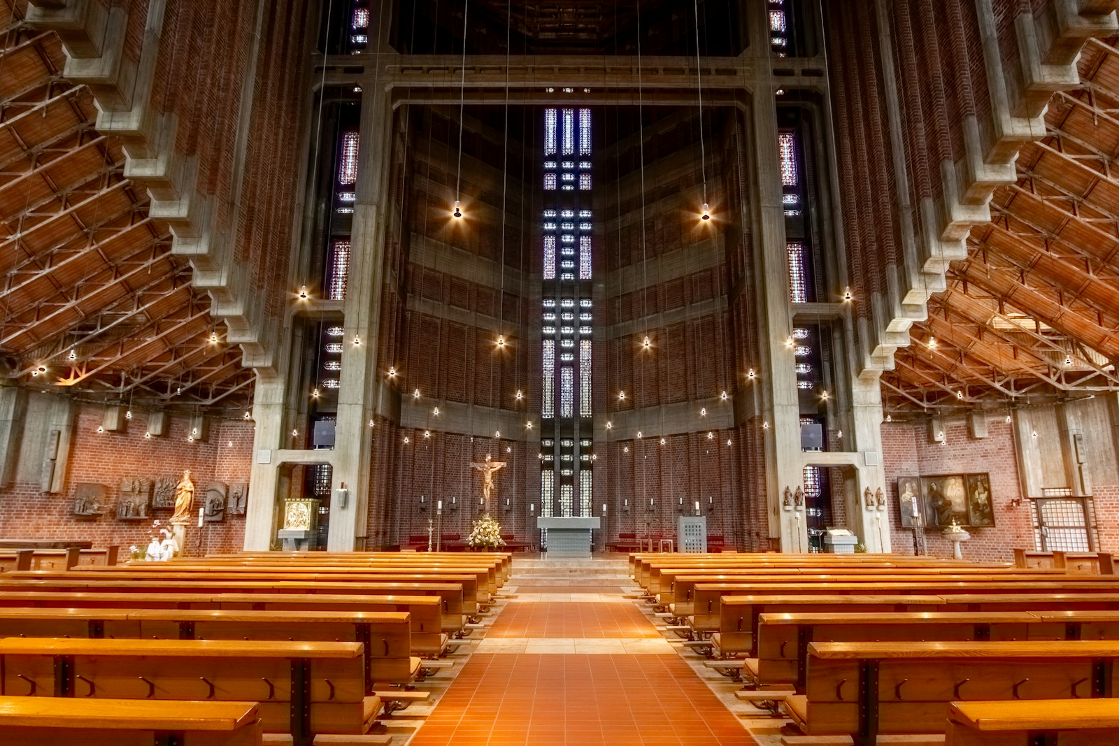 Interior of a modern church with wooden pews and altar