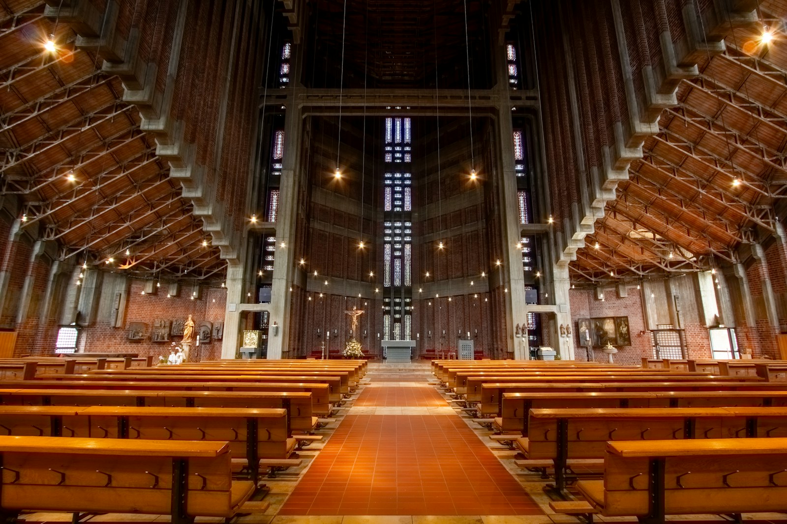 Interior of a modern church with wooden pews and high ceiling