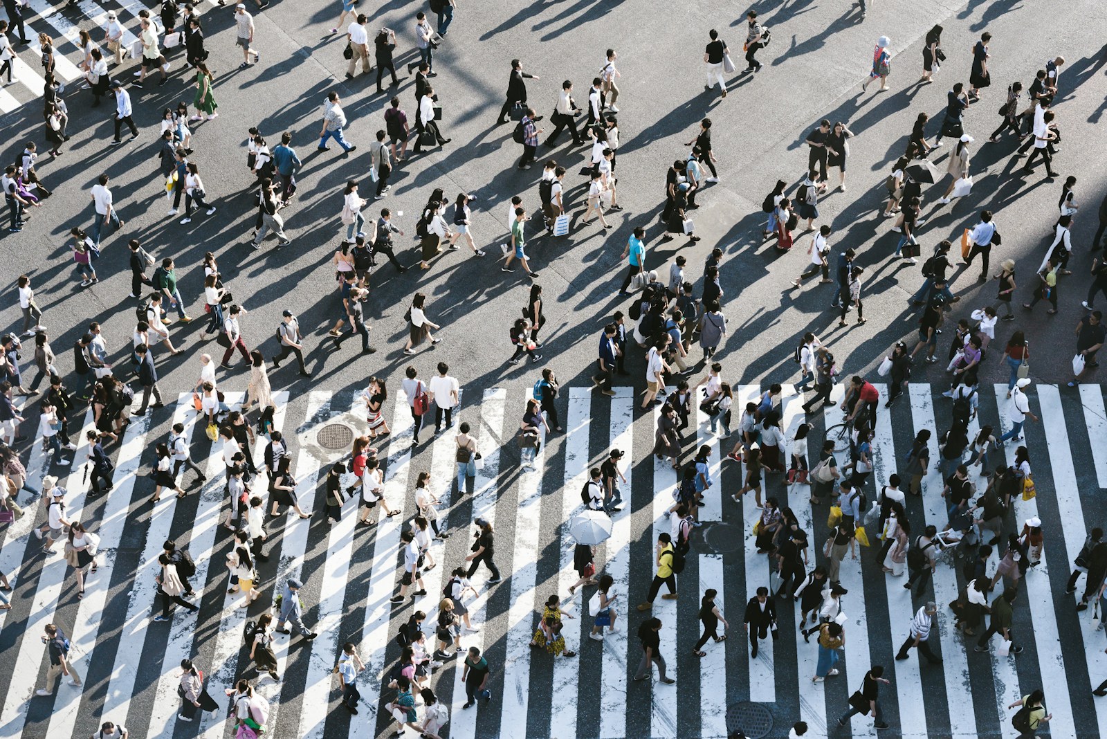 A crowd of people walking across the Shibuya Crossing in Tokyo, Japan