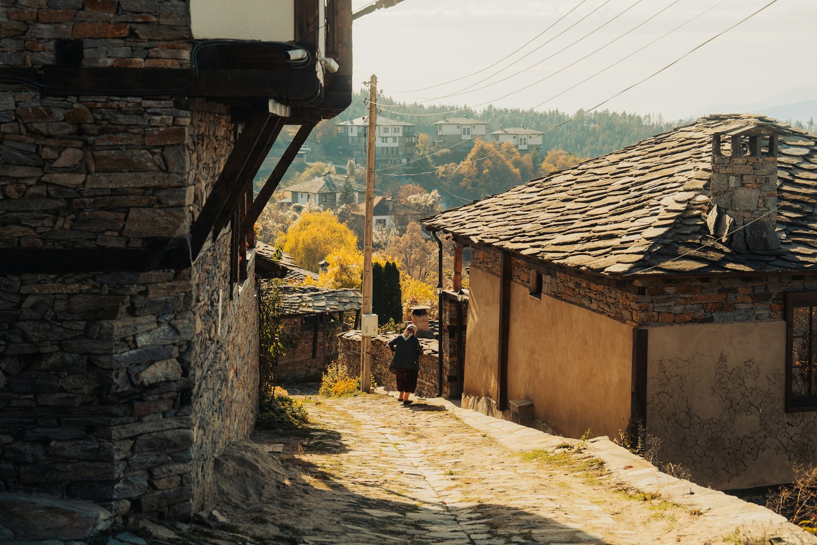 Cobblestone street in a historic village with stone houses