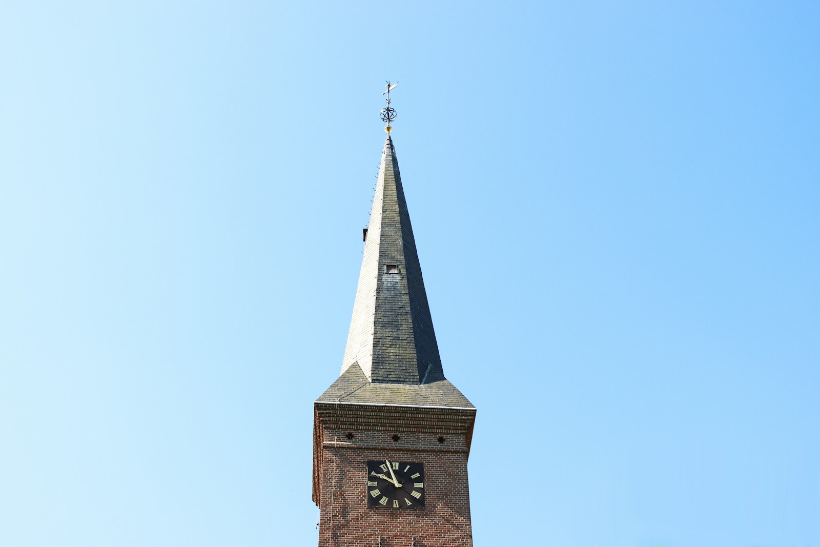 brown concrete tower with clock