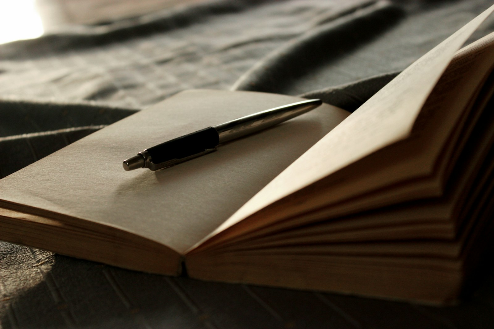 a pen on a book