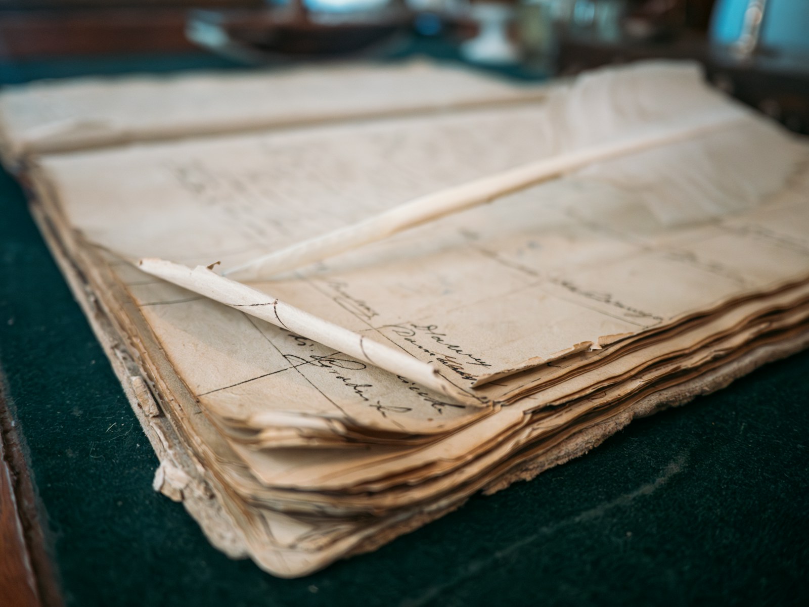 A close-up of an old, open ledger with handwritten notes