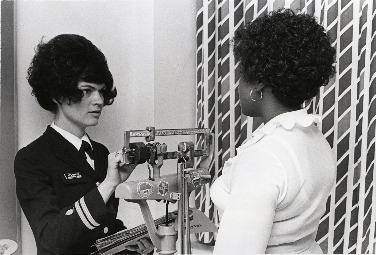 Doctor examines patient's eyes with medical equipment