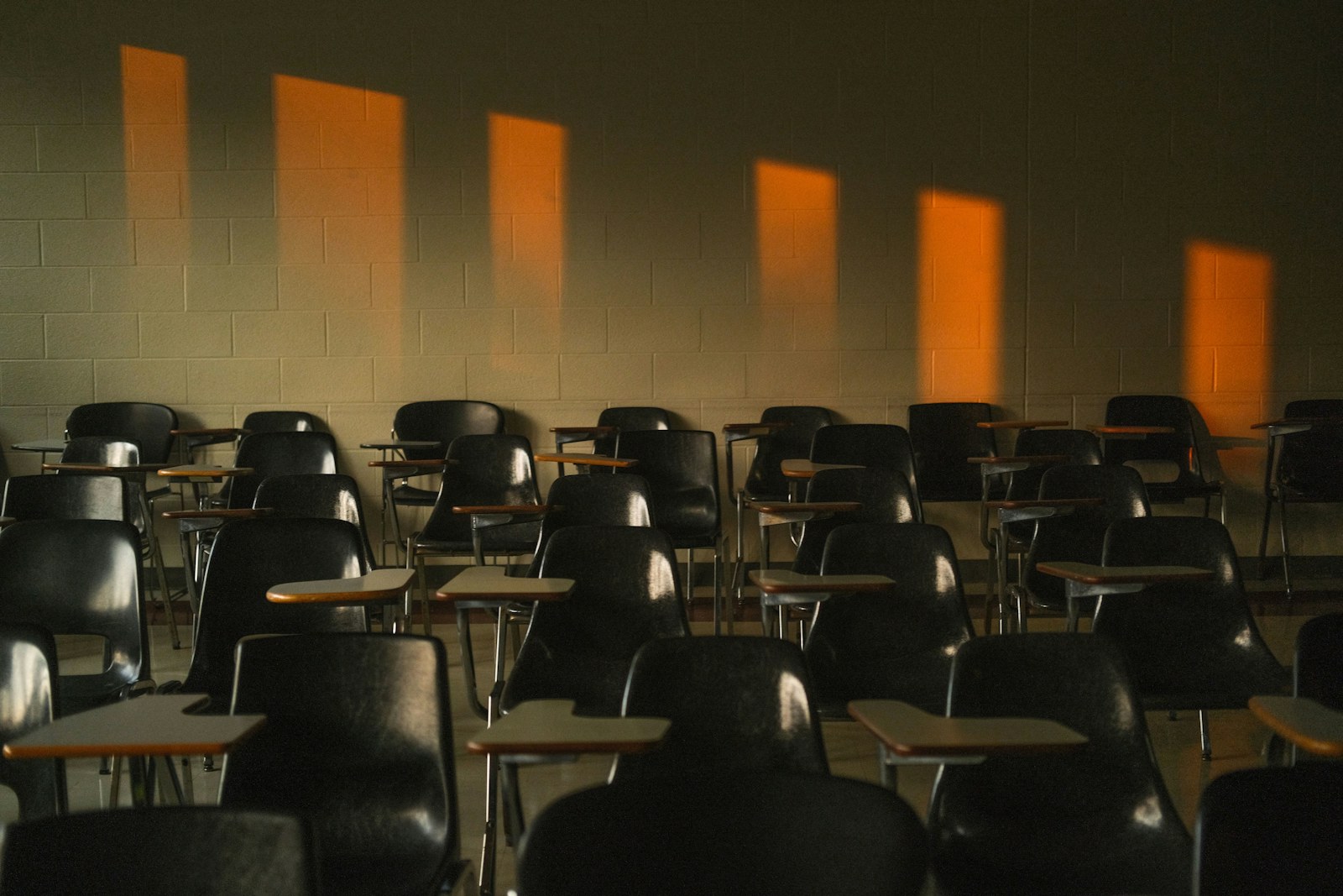 Empty classroom with sunlight shining through windows