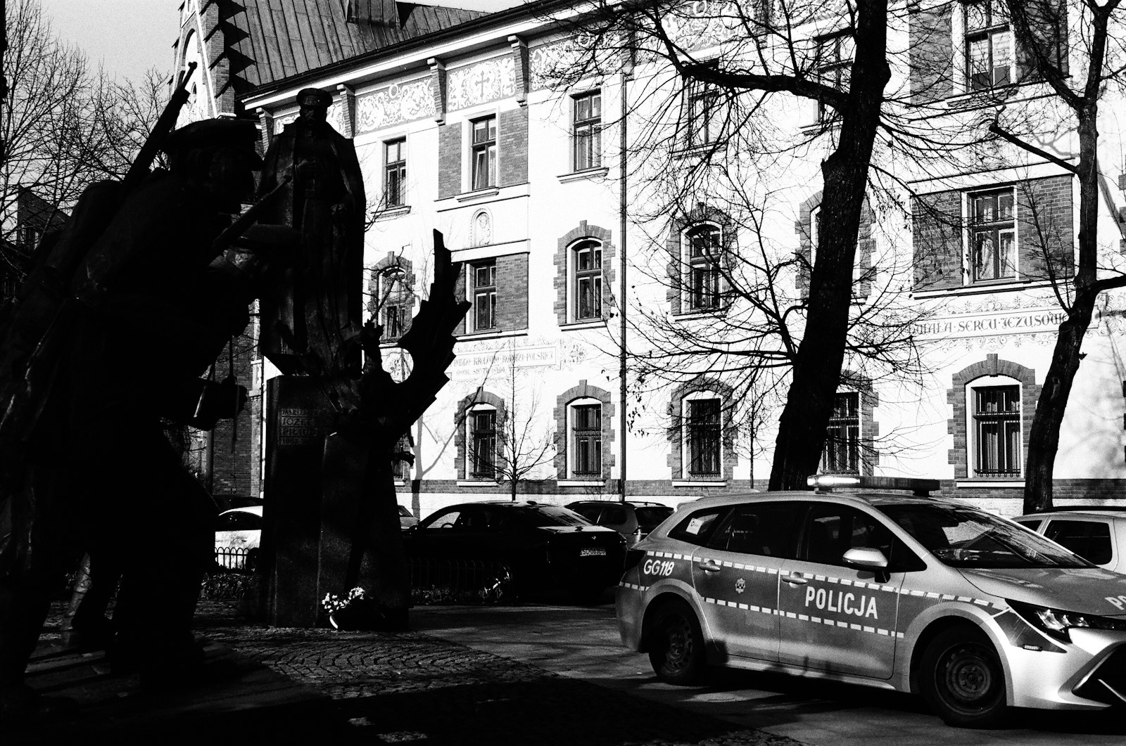 a police car parked in front of a building