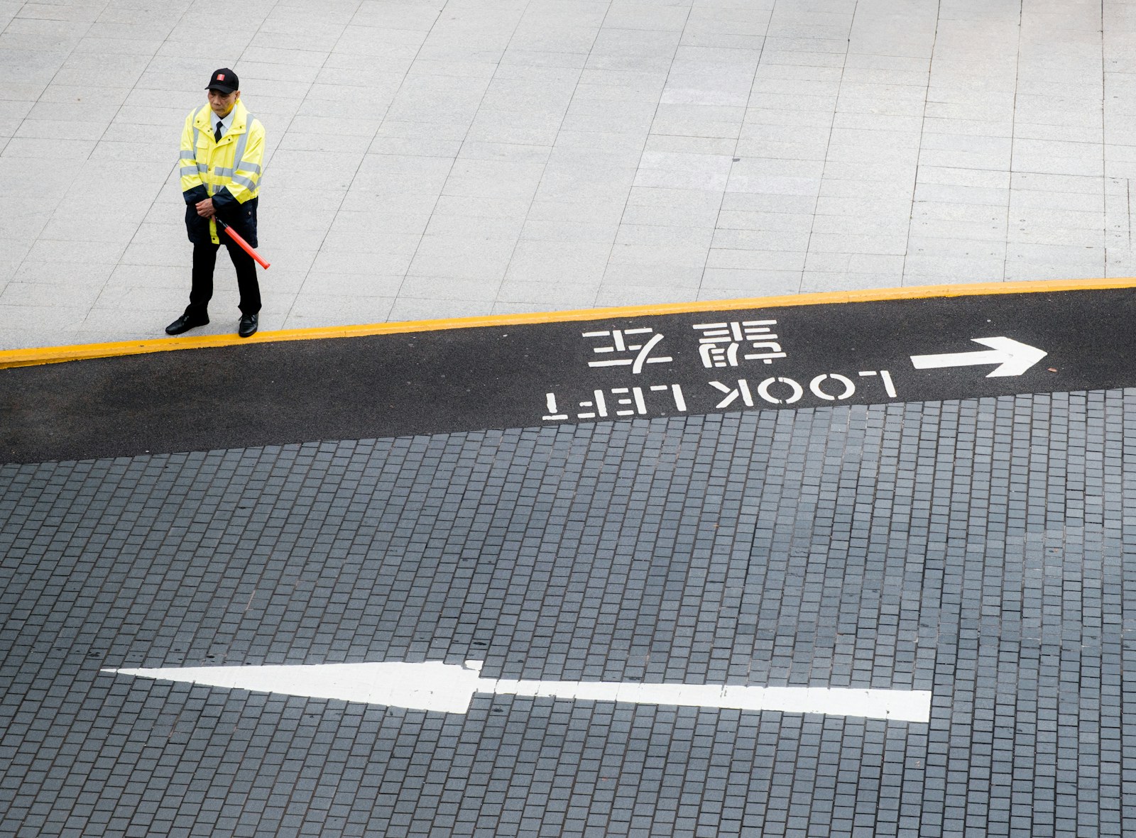 A security guard directs traffic