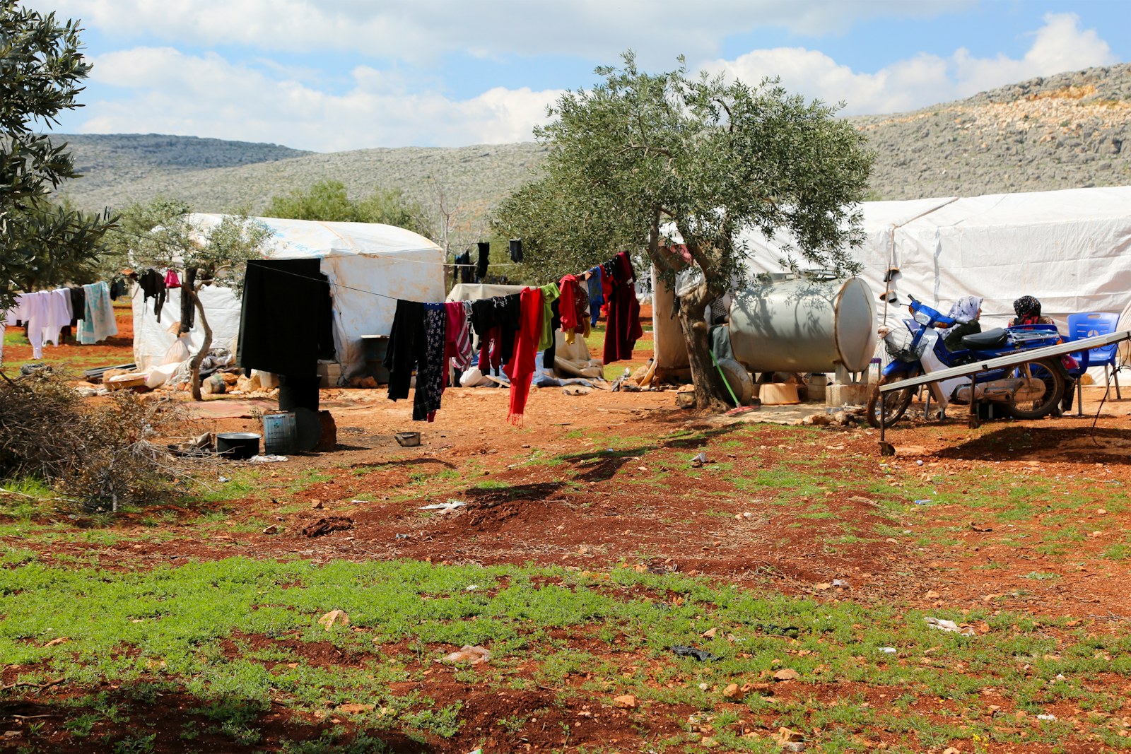 A group of tents sitting next to each other on a field
