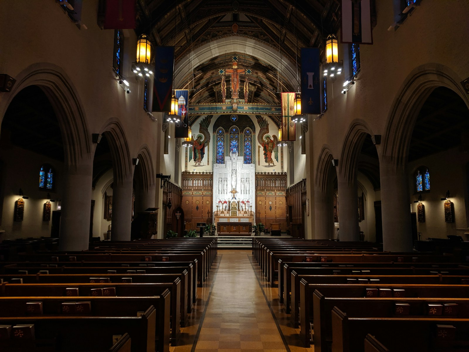 a church with pews and stained glass windows