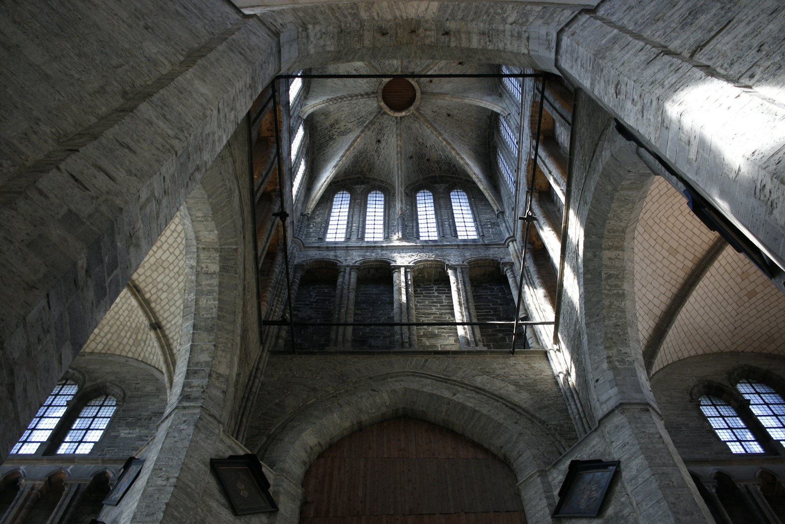 High vaulted ceiling and windows inside a stone church