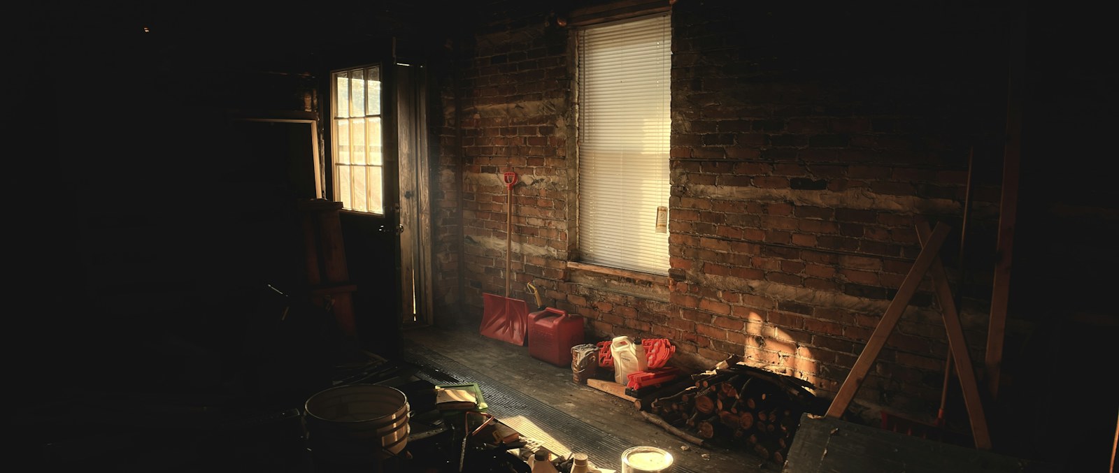 red and black sofa chair near window