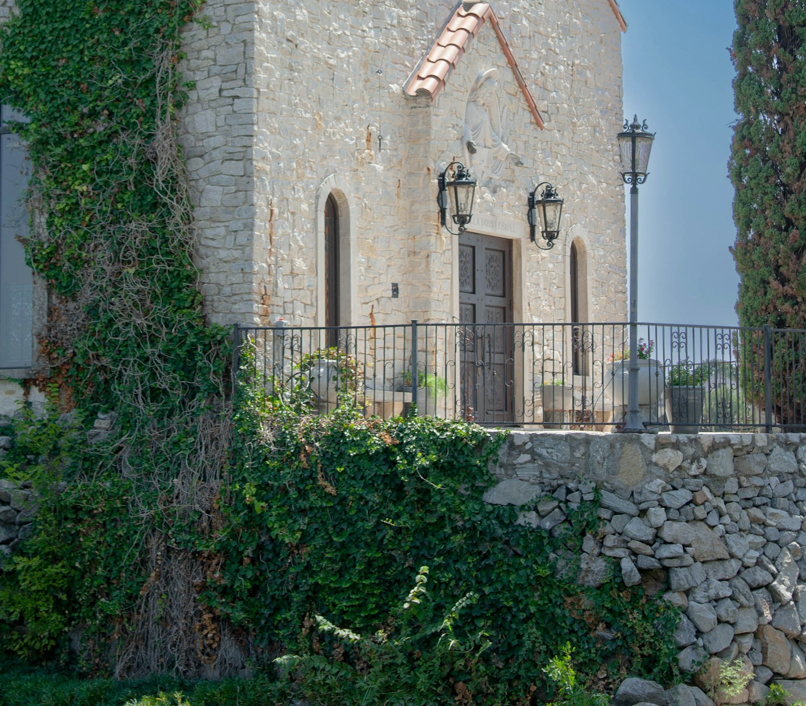 A stone building with a clock tower on top of it