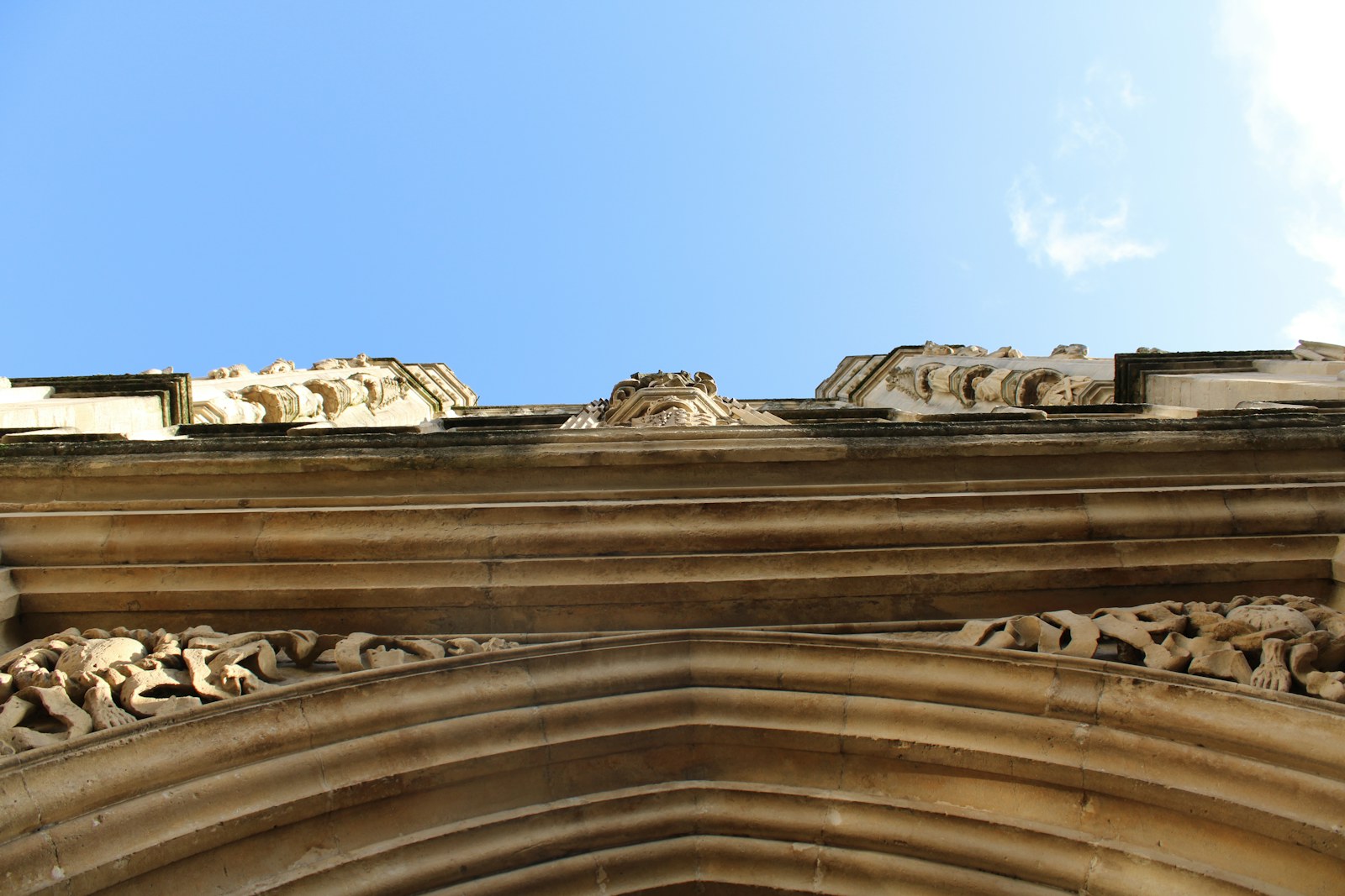 a close up of a building with a sky in the background