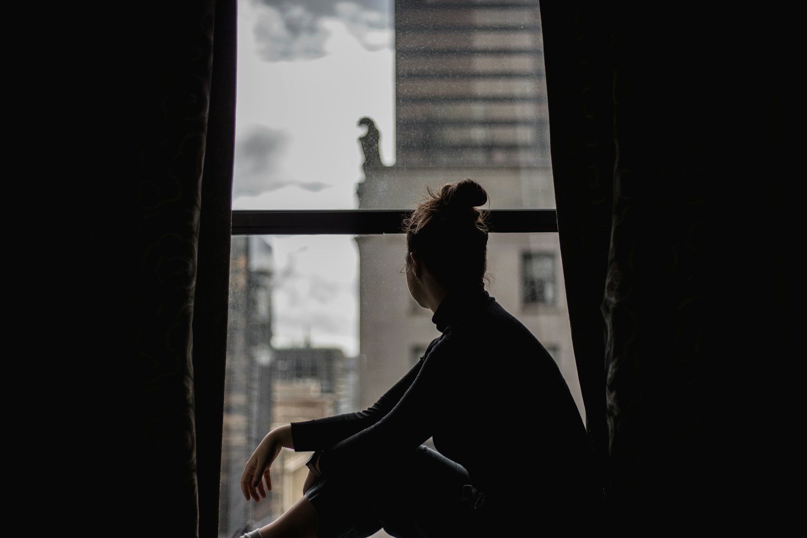 a person sitting in a window