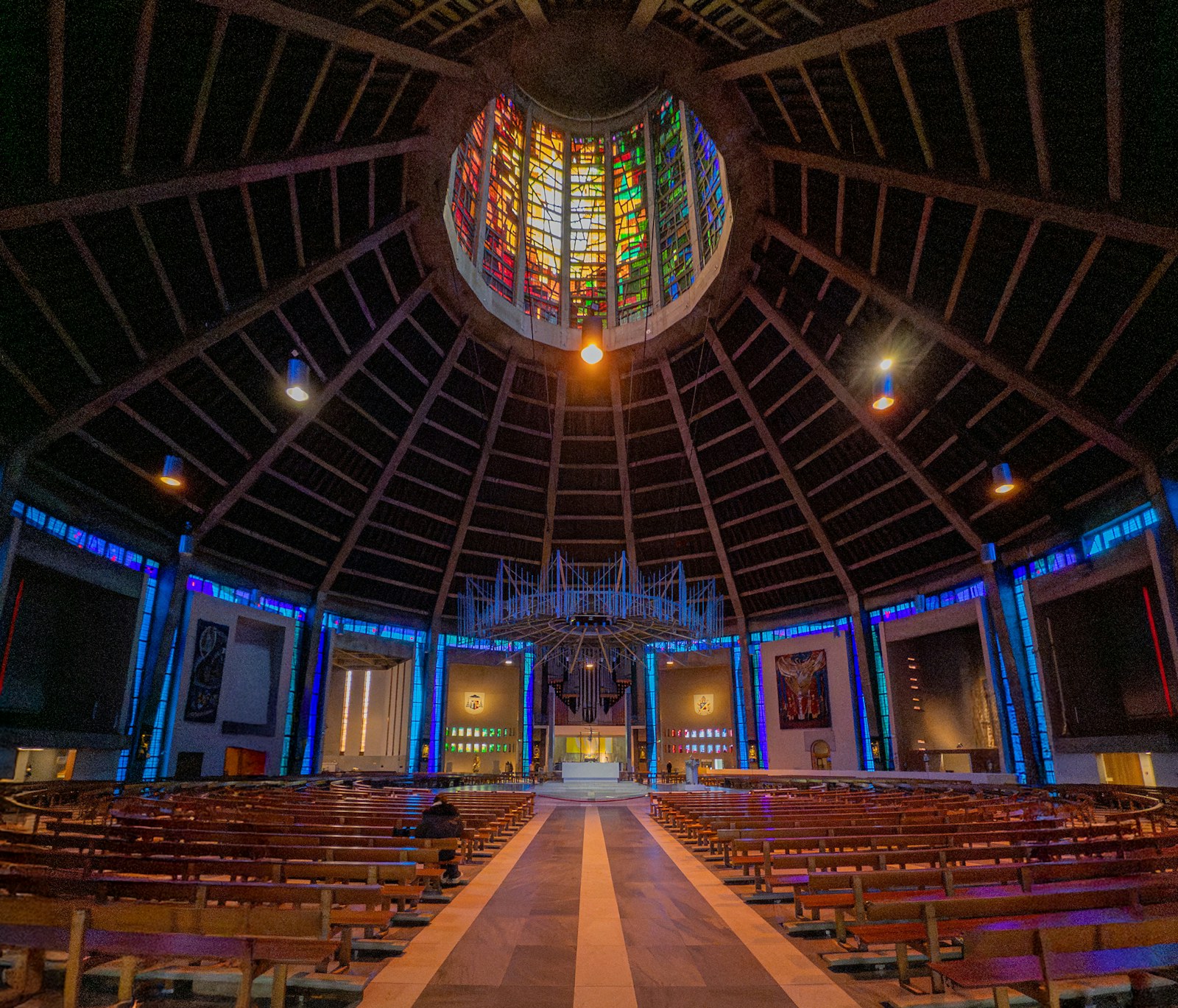 Interior of a modern church with stained glass ceiling