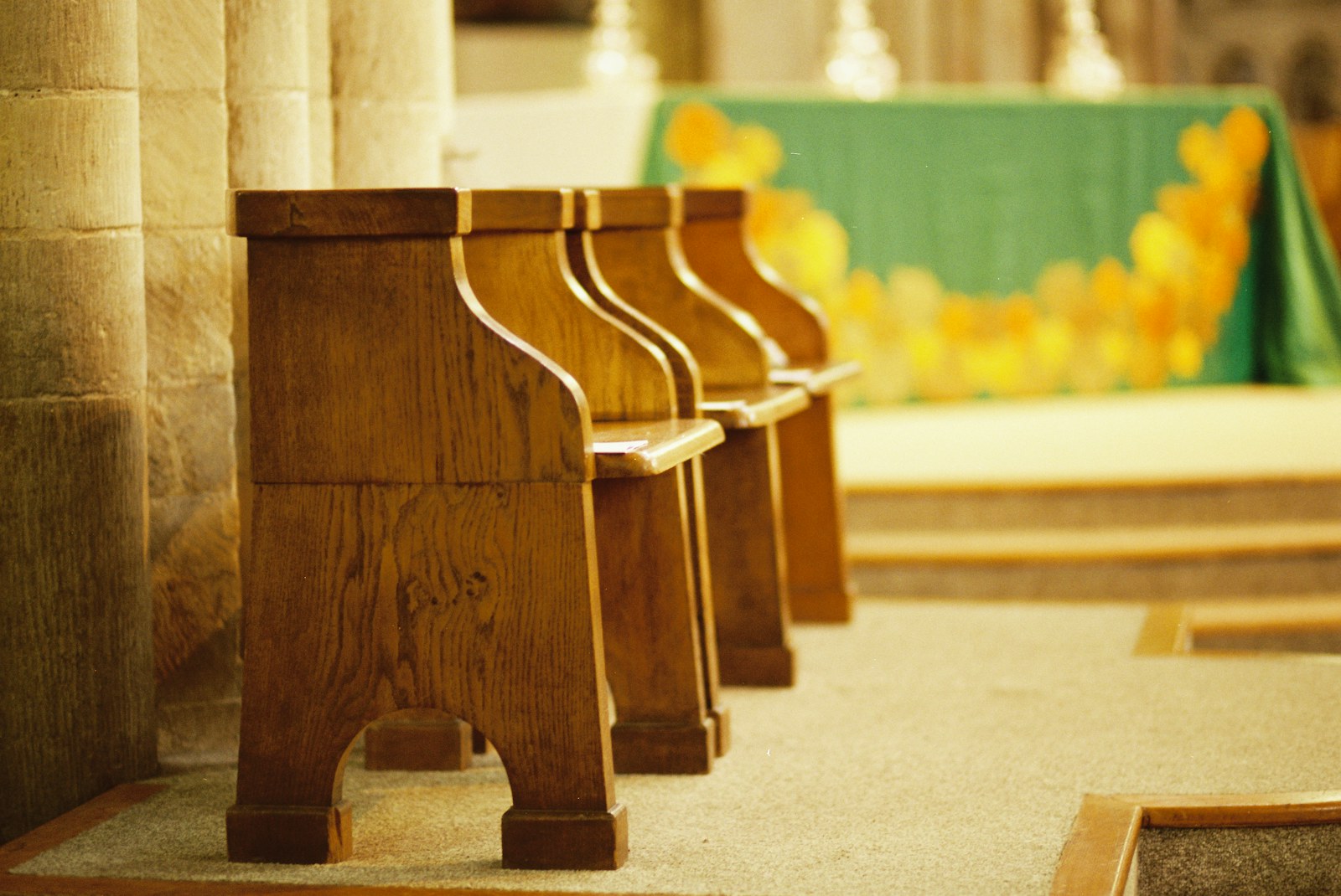 Row of empty wooden pews in a church