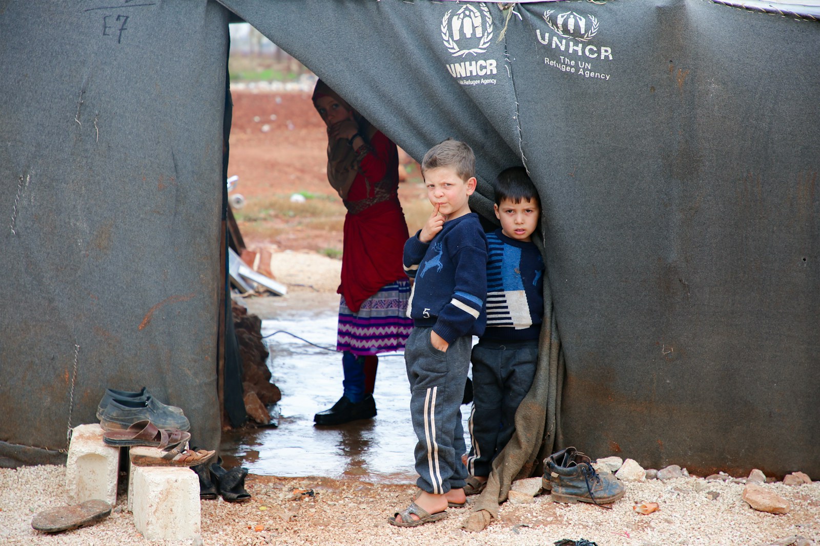 A group of young boys standing next to each other