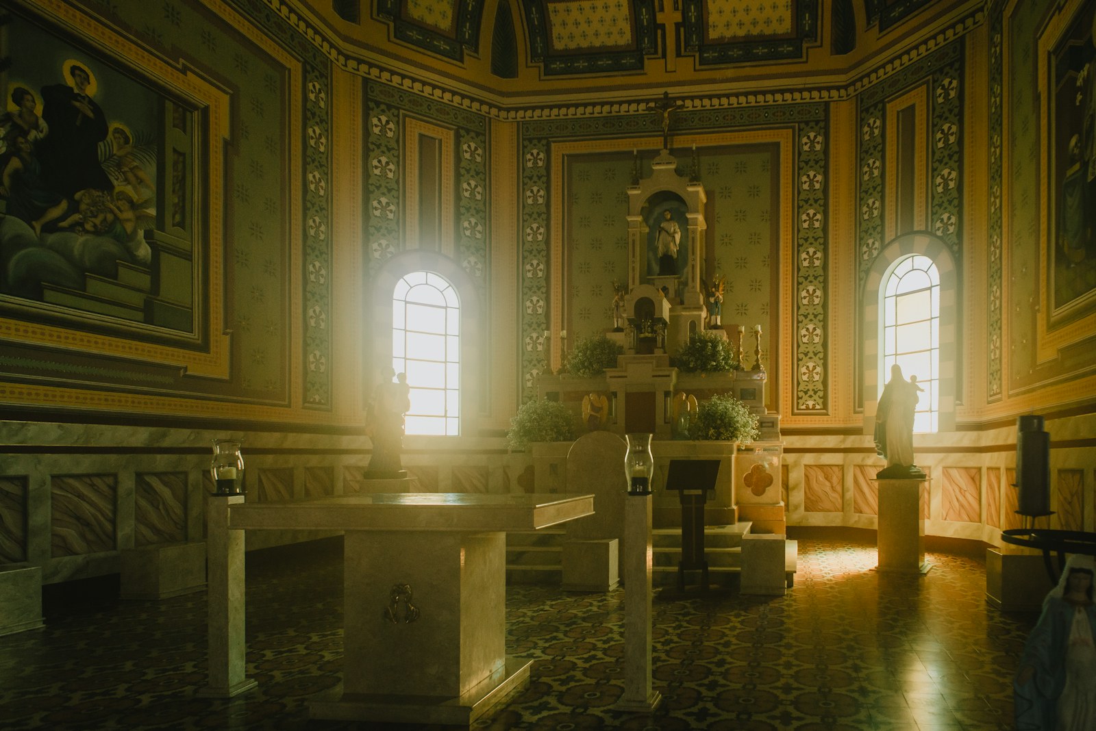 a church with a statue in the middle of the room