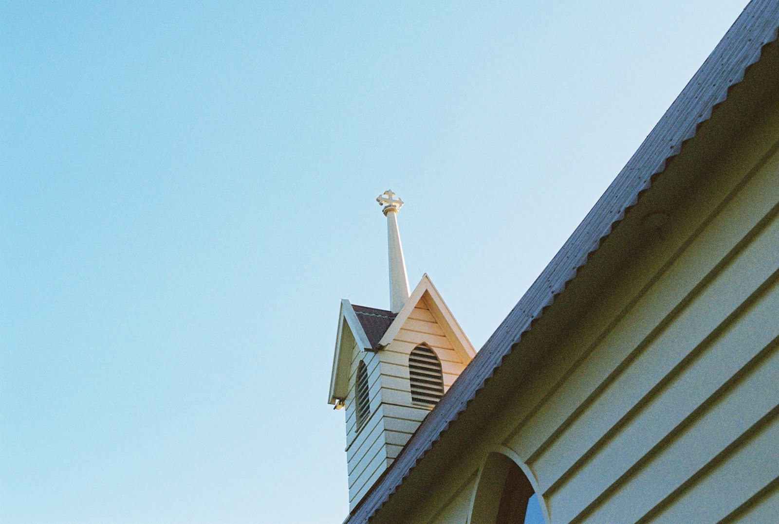 white and brown concrete house under blue sky during daytime