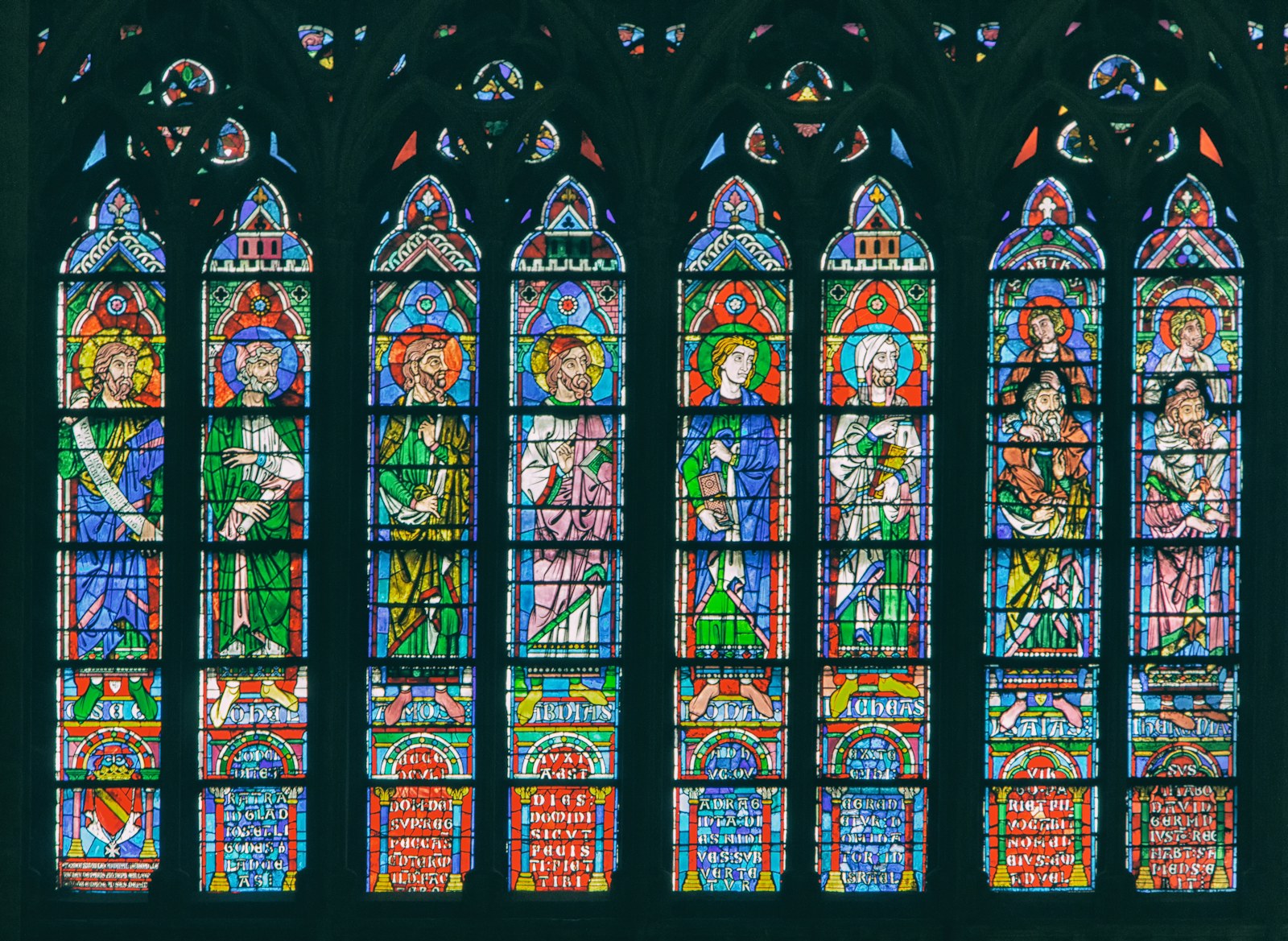 a large stained glass window in a church