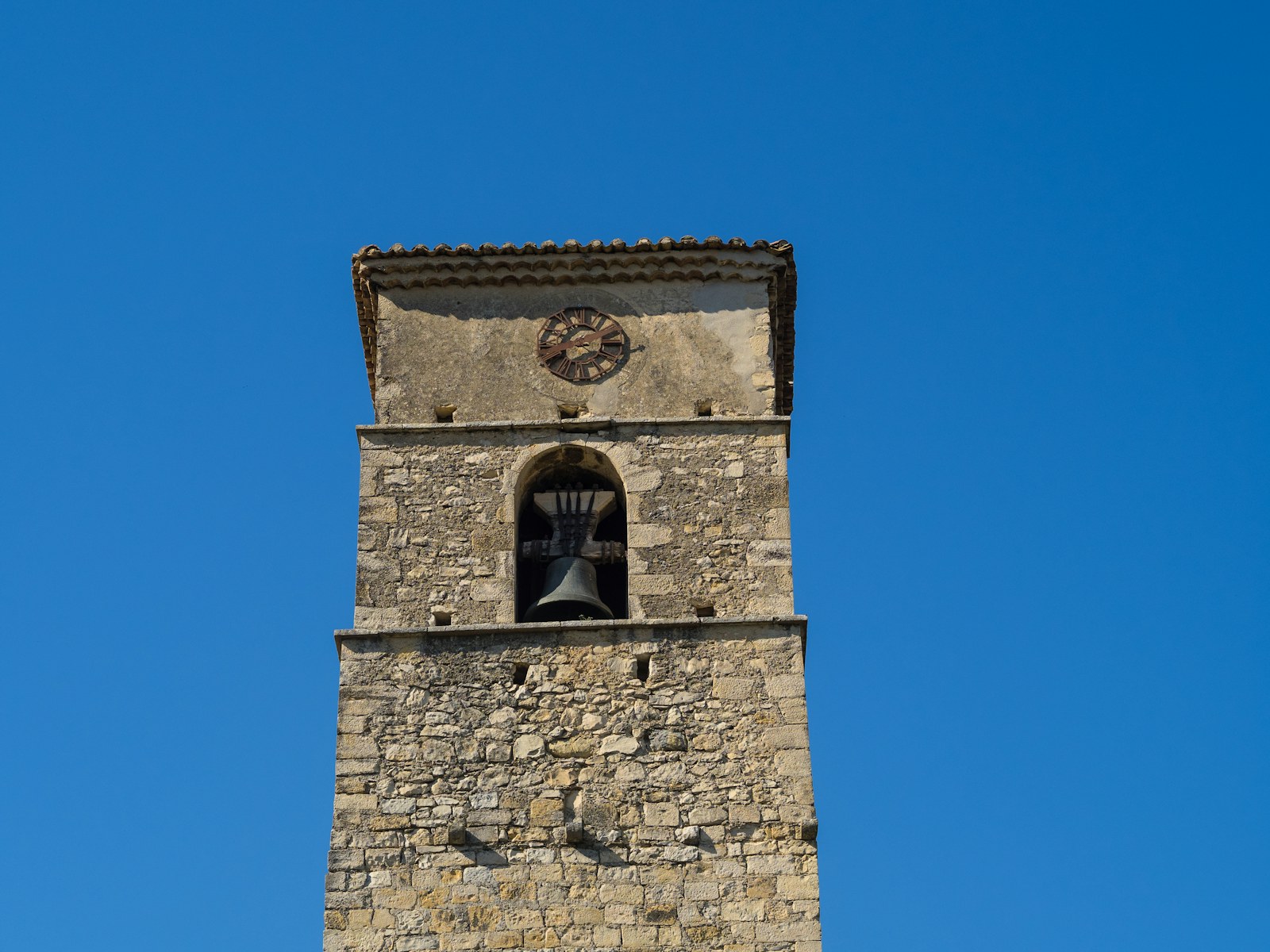 A tall tower with a clock on the top of it