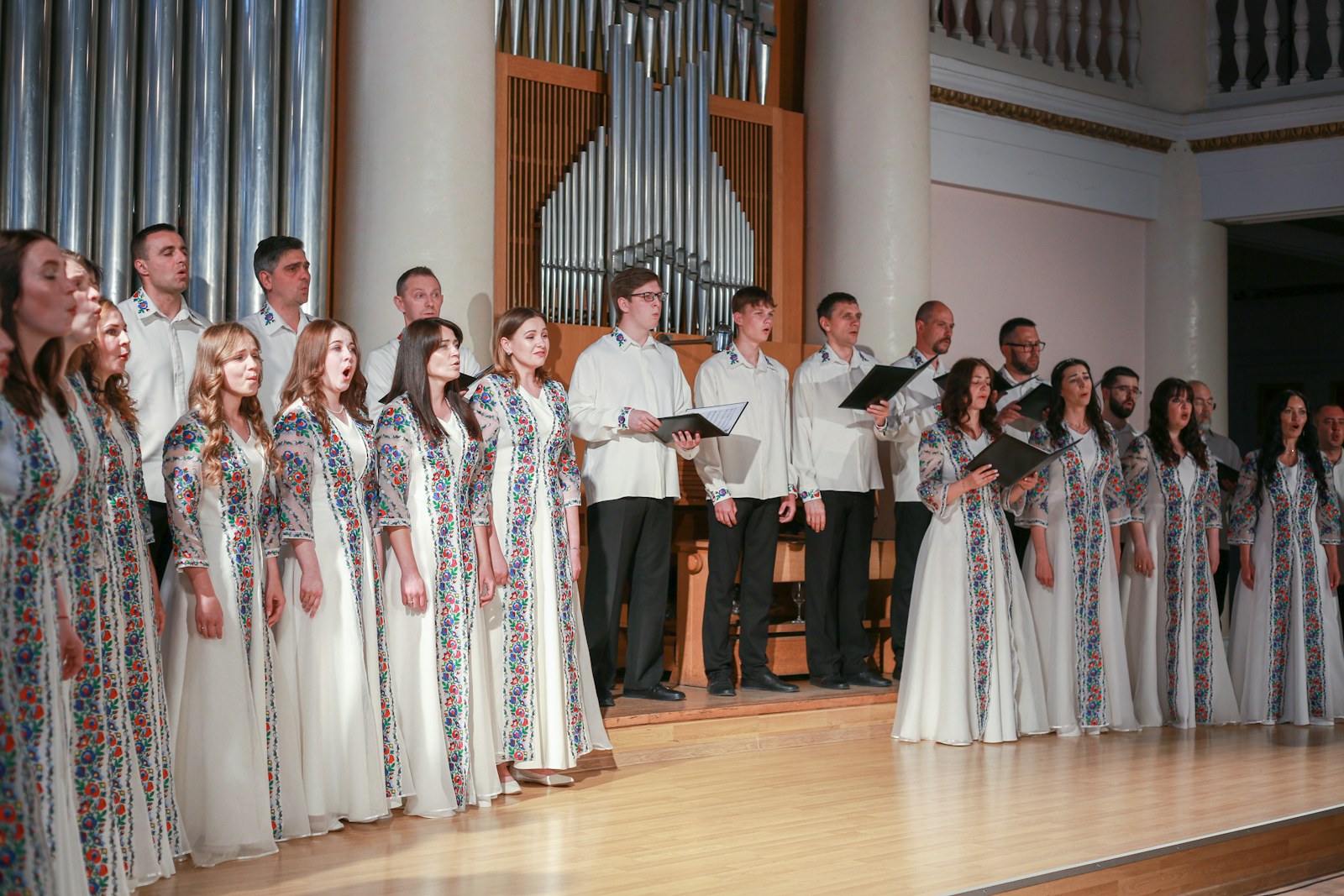 a group of people standing next to each other on a stage