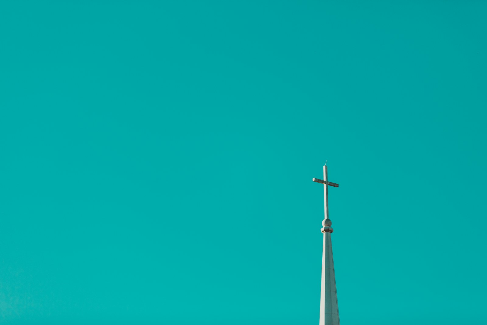 a wind turbine against a blue sky