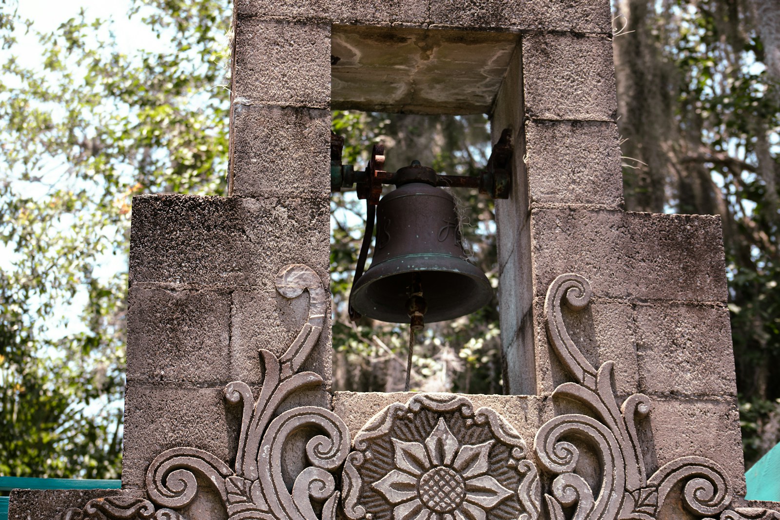 a bell on a stone building
