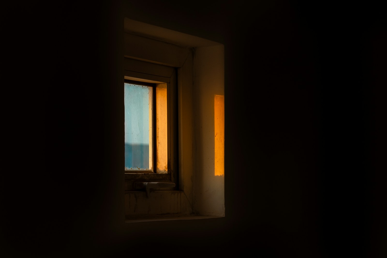 A window with a view of a body of water