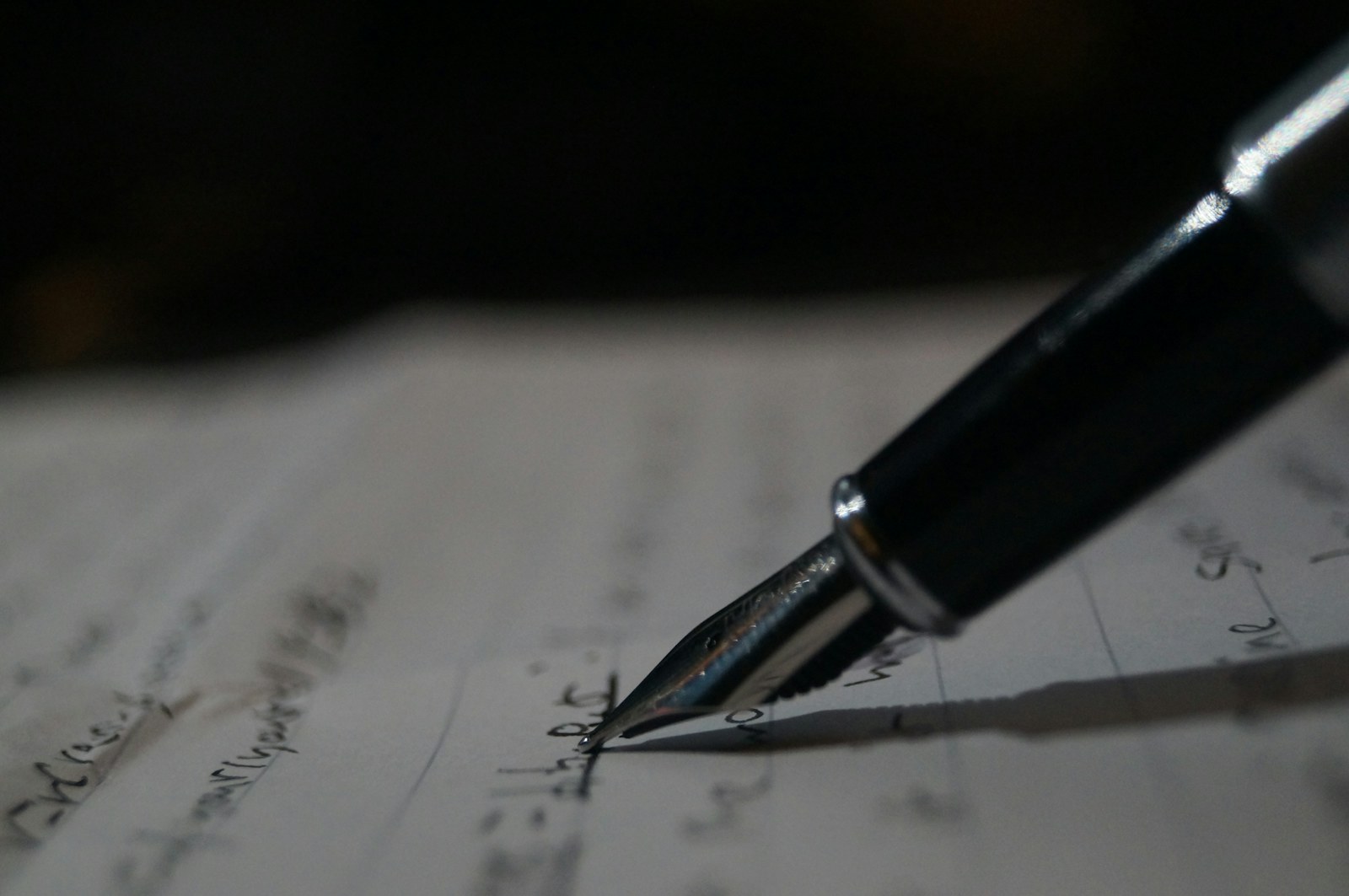 a pen is sitting on top of a piece of paper