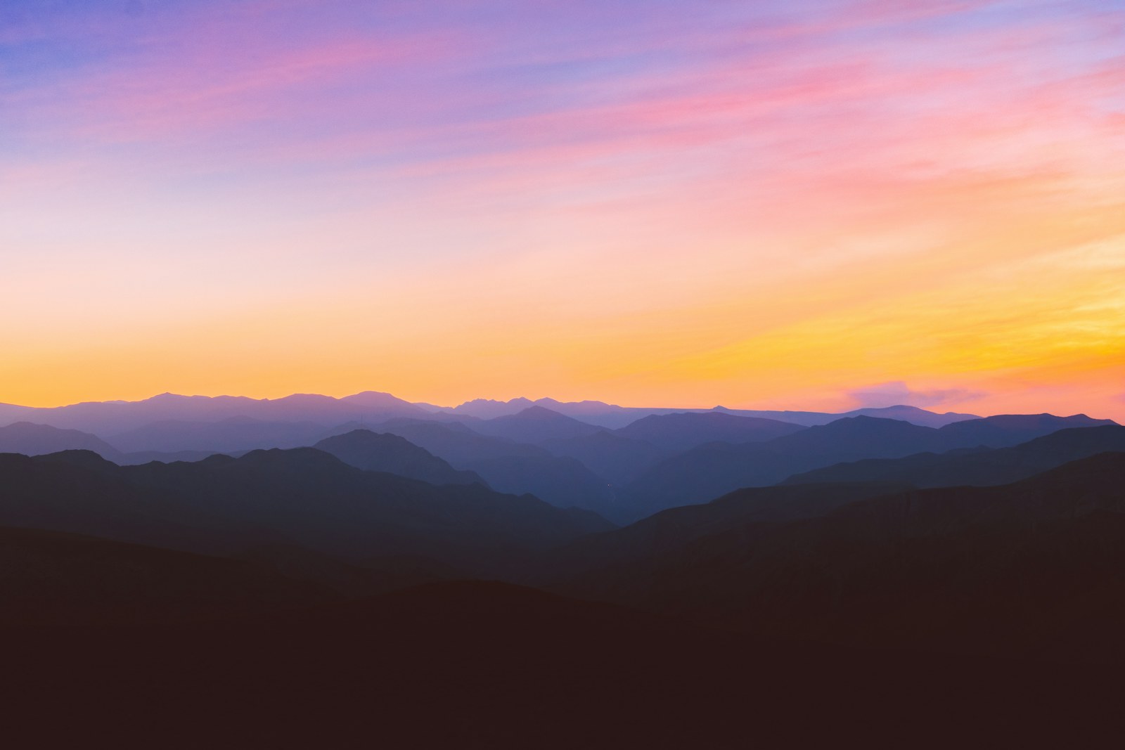 silhouette photo of mountain during golden hour
