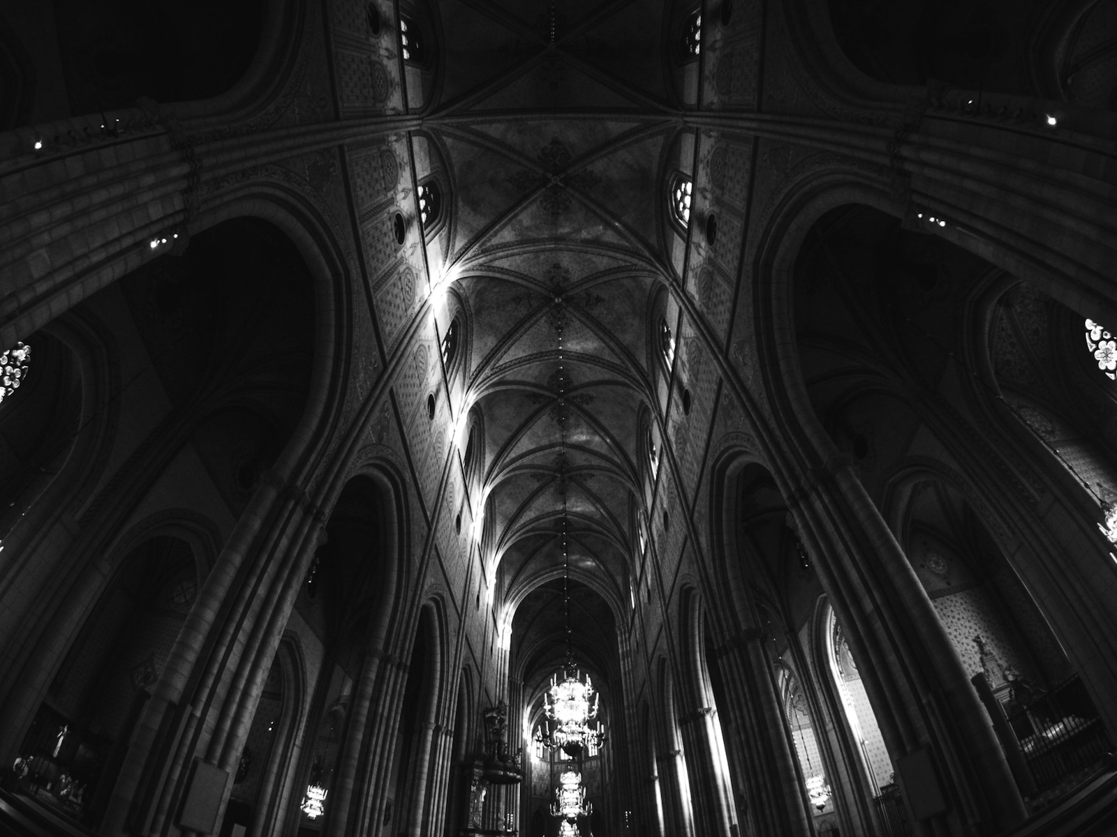 Gothic cathedral interior with vaulted ceilings and stained glass