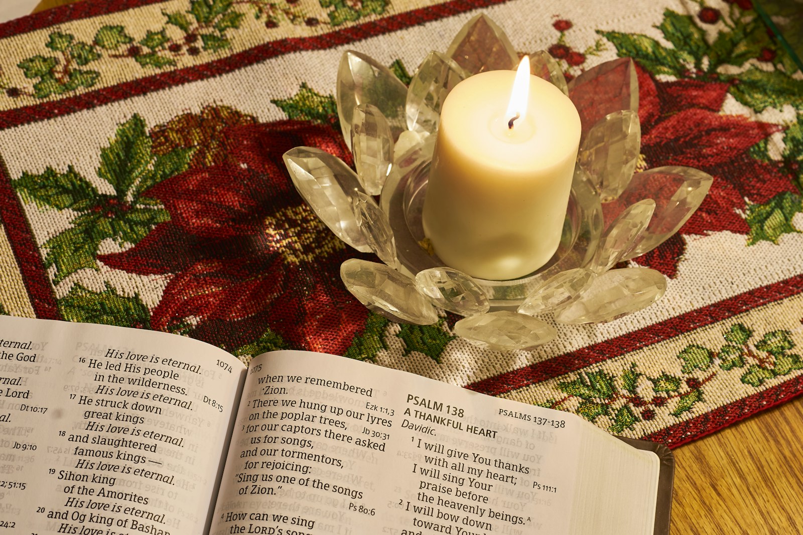 white pillar candle on clear glass holder