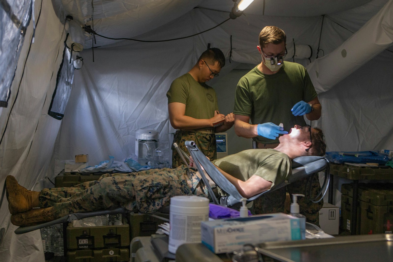 Marines receive dental care inside a tent