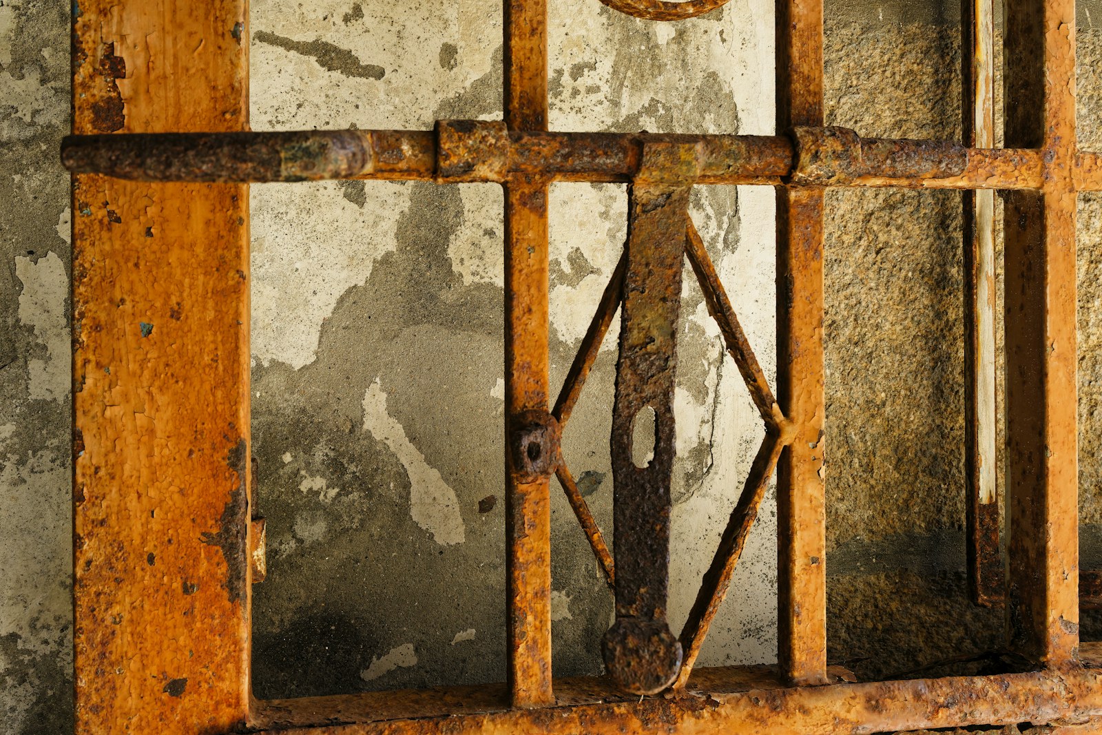 A jail cell with bars and a clock on the wall