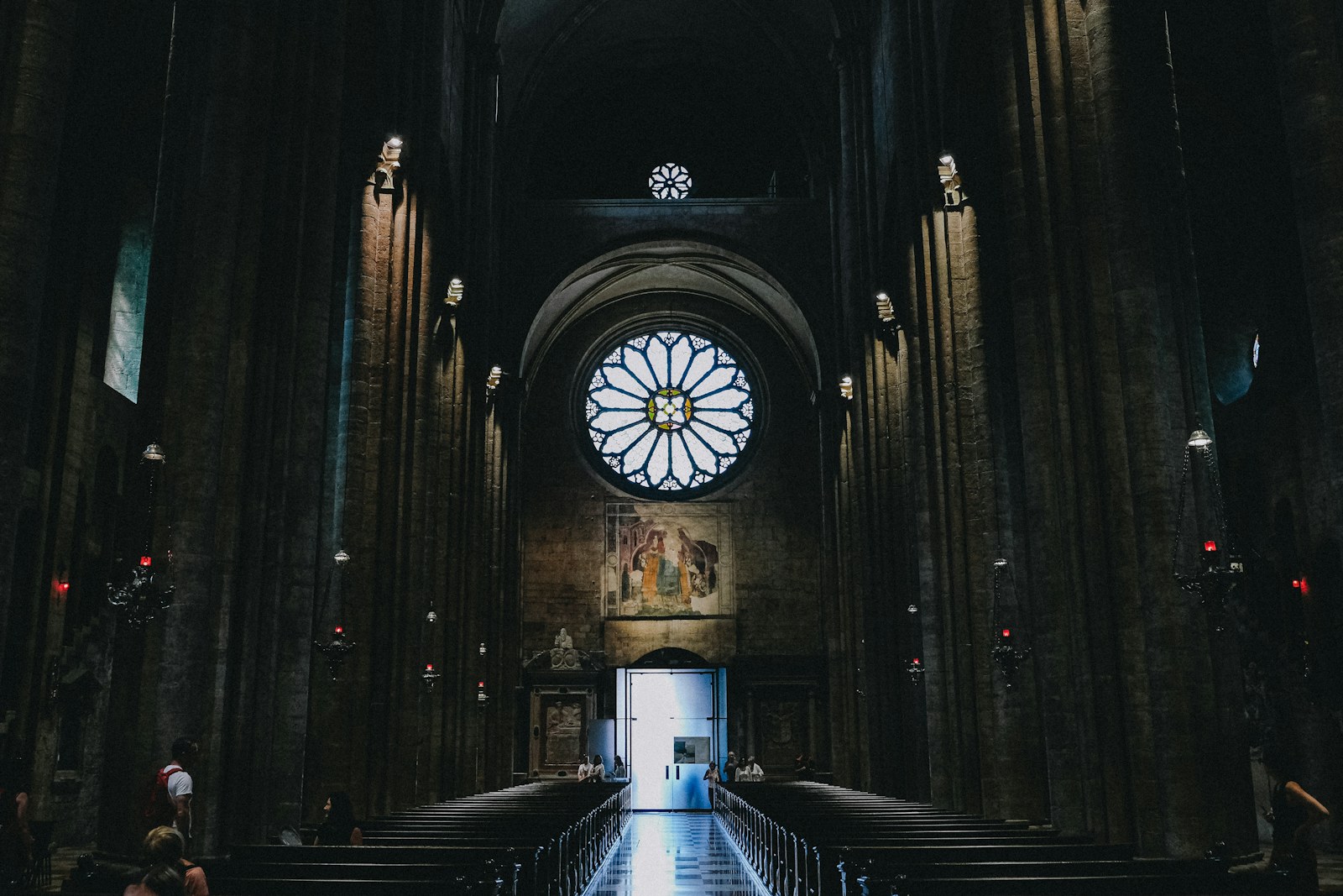 Interior of a grand cathedral with a rose window