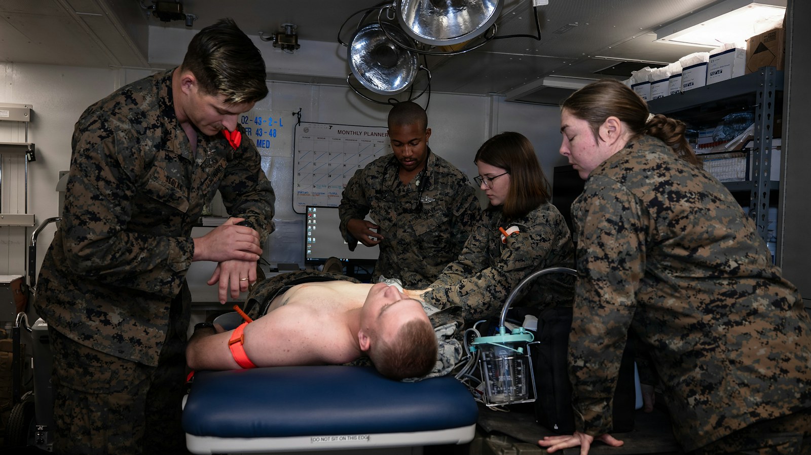 Medical team attending to patient on operating table